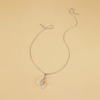 Collar Gota Cristalina con Cruz Interna — Elegancia Minimalista
